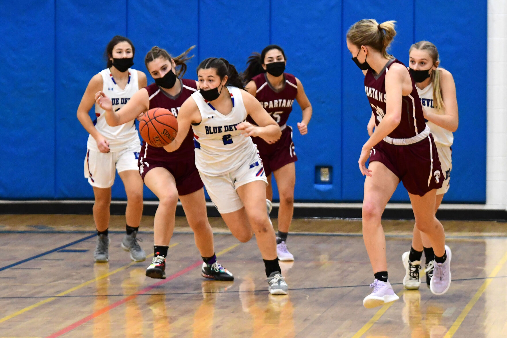 McGrath is surrounded as she dribbles the ball down the court